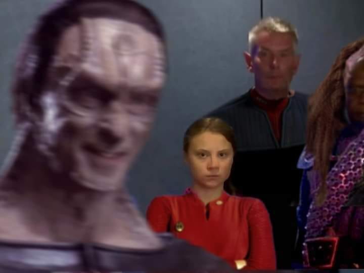 The meme features a still image from the Star Trek: The Next Generation episode "The Perfect Storm," where a character's face is distorted and exaggerated, with a wide, toothy grin. The image is captioned "when you're trying to be professional but your team is being a bunch of nerds".